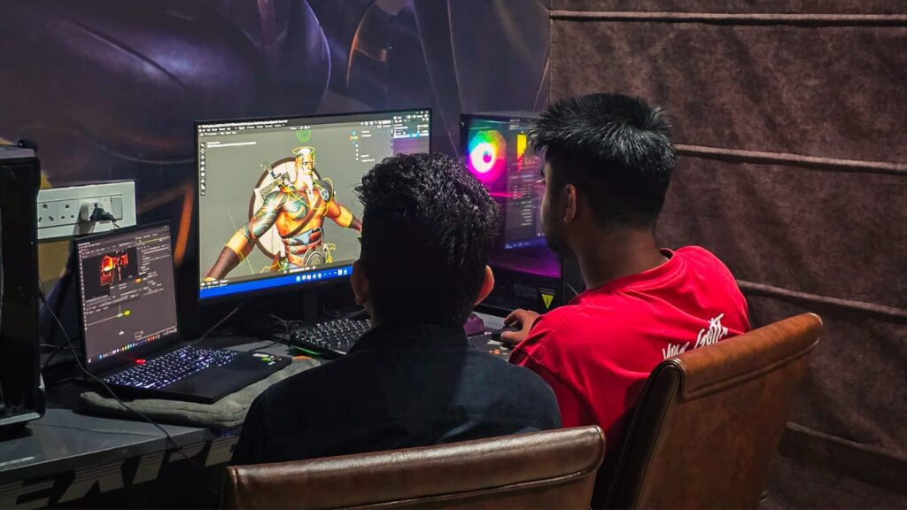 students are working on desktop designing characters using 3D animation and VFX